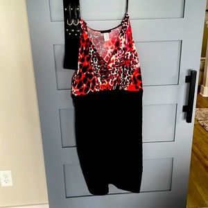 Women’s dress with small sleeve printed top with black bottom.Size 18